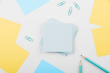 Notebook and Colored Papers Stickers Lying On Desk. Collection Stationery.