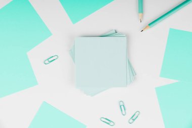 Notebook and Colored Papers Stickers Lying On Desk. Collection Stationery.