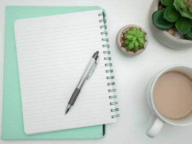 Coffee Cup Standing on Desk. Important infrormation written on paper.