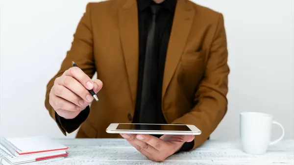 Man Jacket Sitting White Table Pointing Pen Message — Fotografia de Stock