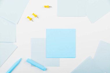 Notebook and Colored Papers Stickers Lying On Desk. Collection Stationery.