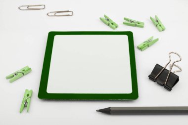 Important Messages. Sticker Lying On White Desk With Clotherspins.