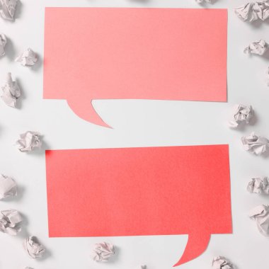 Important Messages On Two Sticky Red Notes On Desk With Paper Wraps.