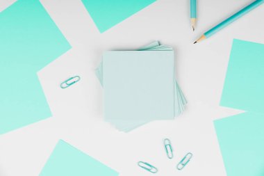 Notebook and Colored Papers Stickers Lying On Desk. Collection Stationery.