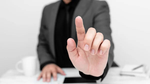 Businessman Sitting Table Pointing One Finger Message —  Fotos de Stock