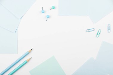 Notebook and Colored Papers Stickers Lying On Desk. Collection Stationery.