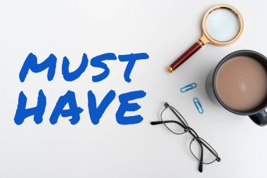 Inspiration showing sign Must Have, Word Written on something modern that many people want to have Essential item