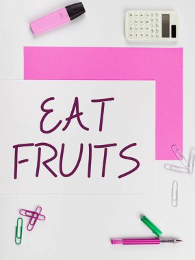 Sign displaying Eat Fruits, Word Written on consume any product of plant growth useful to humans or animals