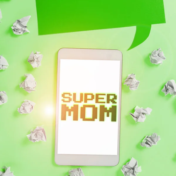 Writing displaying text Super Mom, Concept meaning a mother who can combine childcare and full-time employment