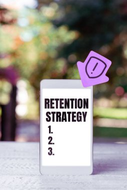 Sign displaying Retention Strategy, Business approach activities to reduce employee turnover and attrition