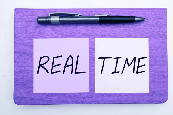 Hand writing sign Real Time, Business overview the actual time during which a processes or events occurs