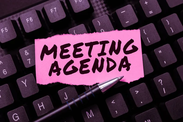 Hand writing sign Meeting Agenda, Word Written on An agenda sets clear expectations for what needs to a meeting