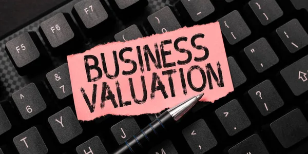 Hand writing sign Business Valuation, Word Written on determining the economic value of a whole business