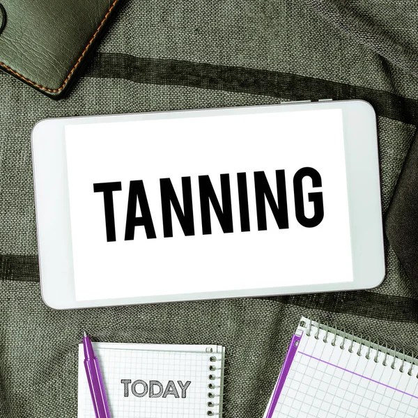 Text sign showing Tanning, Conceptual photo a natural darkening of the scin tissues after exposure to the sun
