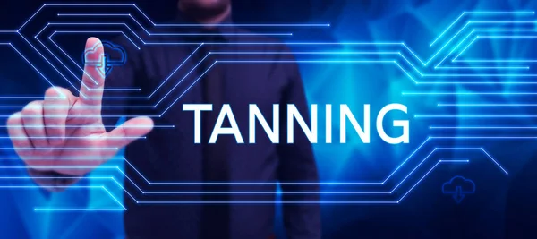 Handwriting text Tanning, Business showcase a natural darkening of the scin tissues after exposure to the sun