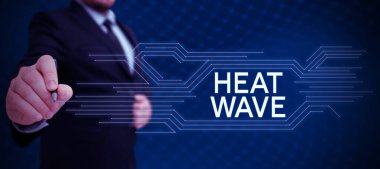Hand writing sign Heat Wave, Business concept a prolonged period of abnormally hot weather