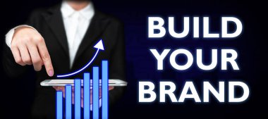 Writing displaying text Build Your Brand, Business idea Make a commercial identity Marketing Advertisement