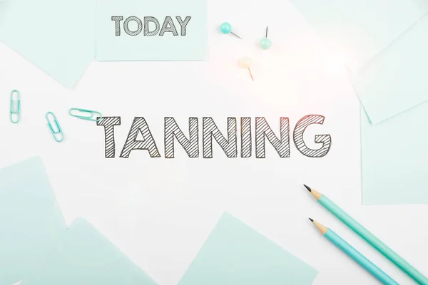 Handwriting text Tanning, Concept meaning a natural darkening of the scin tissues after exposure to the sun