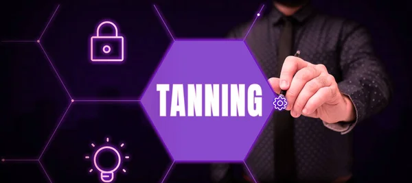 Text showing inspiration Tanning, Business approach a natural darkening of the scin tissues after exposure to the sun