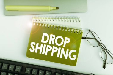 Text sign showing Drop Shipping, Internet Concept to send goods from a manufacturer directly to a customer instead of to the retailer