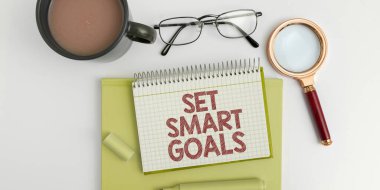 Hand writing sign Set Smart Goals, Conceptual photo Establish achievable objectives Make good business plans