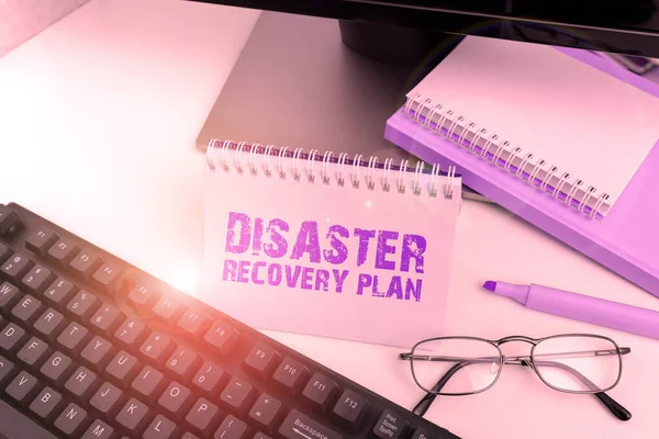 Hand writing sign Disaster Recovery Plan, Conceptual photo having backup measures against dangerous situation