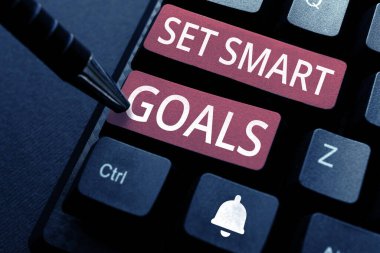 Conceptual display Set Smart Goals, Word Written on Establish achievable objectives Make good business plans