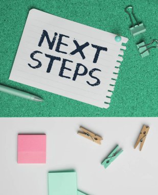 Sign displaying Next Steps, Business showcase numper of process going to be made after current one planning