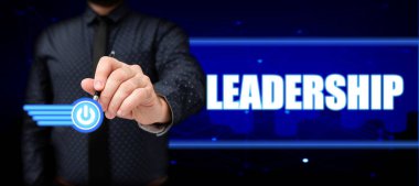 Liderlik, Kavramsal Fotoğraf Yeteneği Faaliyetlerinin bir grup insanı veya şirketi yönettiğini gösteren bir tabela