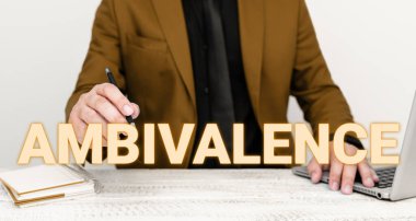 Conceptual caption Ambivalence, Word Written on attitudes or feelings attraction and repulsion to an object person or action