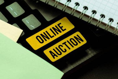 Handwriting text Online Auction, Conceptual photo process of buying and selling goods or services online