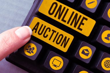 Handwriting text Online Auction, Concept meaning process of buying and selling goods or services online