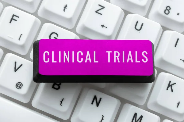 Text caption presenting Clinical Trials, Internet Concept Research investigation to new treatments to people