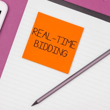 Text caption presenting Real Time Bidding, Business approach Buy and sell advertising inventory by instant auctions