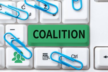Sign displaying Coalition, Word for a temporary alliance of distinct parties, persons, or states for joint action