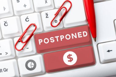 Writing displaying text Postponed, Business idea to place later in order of precedence, preference, or importance