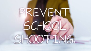 Hand writing sign Prevent School Shooting, Business concept actions committed to terminate use of firearms in educational facilities