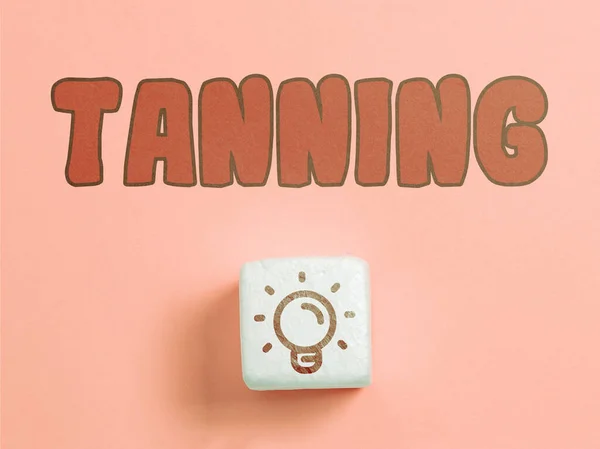 Text caption presenting Tanning, Word Written on a natural darkening of the scin tissues after exposure to the sun