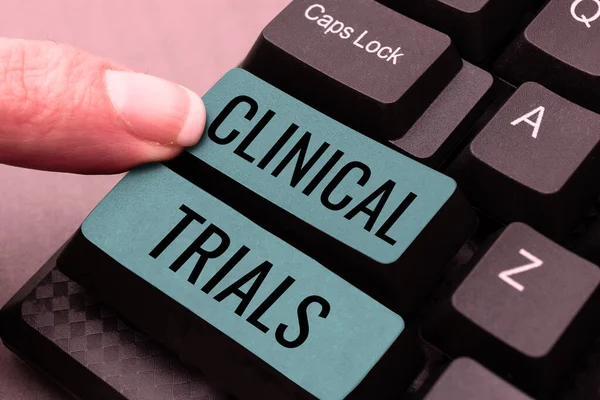 Text caption presenting Clinical Trials, Business concept Research investigation to new treatments to people