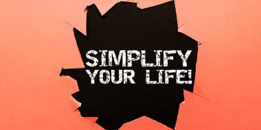 Hand writing sign Simplify Your Life, Word Written on focused on important and let someone else worry about less ones