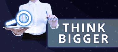 Yazı başlığı sunar. Daha büyük düşün, iş konsepti. Neler başarabileceğini hayal etmek ve görselleştirmek.