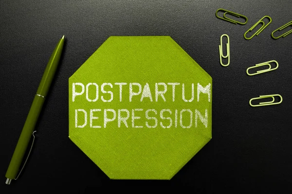 Hand writing sign Postpartum Depression, Business concept a mood disorder involving intense depression after giving birth