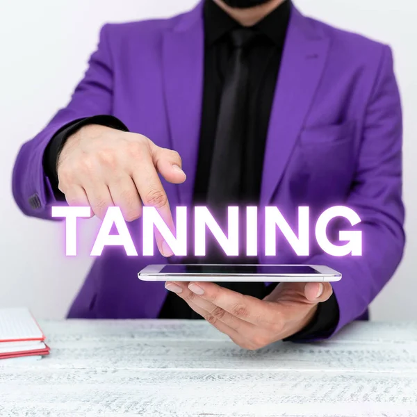 Sign displaying Tanning, Business showcase a natural darkening of the scin tissues after exposure to the sun