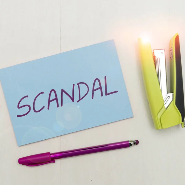 stock image Text sign showing Scandal, Business idea an action or event regarded as morally or legally wrong causing public outrage