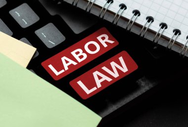 Handwriting text Labor Law, Concept meaning rules relating to rights and responsibilities of workers