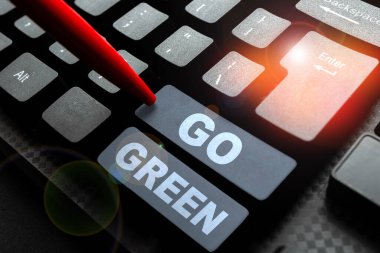 Hand writing sign Go Green, Internet Concept making more environmentally friendly decisions as reduce recycle
