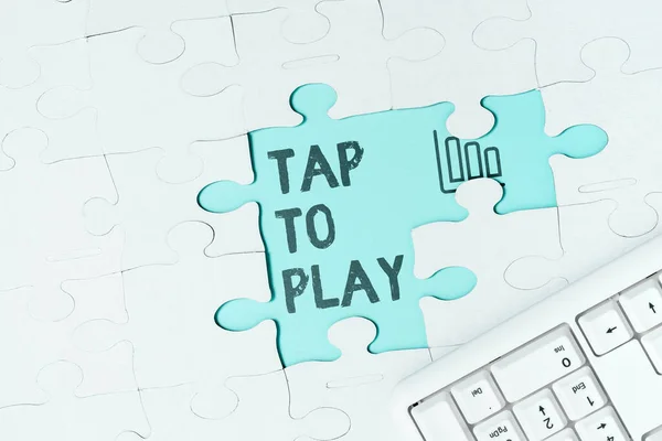 Text caption presenting Tap To Play, Word for Touch the screen to start playing a game or something else