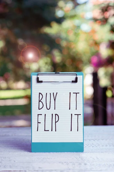 Sign displaying Buy It Flip It, Word Written on Buy something fix them up then sell them for more profit