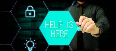 Writing displaying text Help Is Here, Word for The action of helping someone to do something Improve a situation