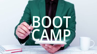 Conceptual caption Boot Camp, Business overview Military training camp for new recruits Harsh discipline Fitness